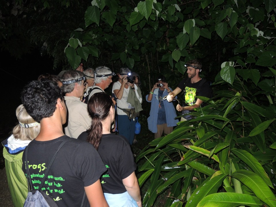 The group checking out the Parrot Snake being held by Michael.