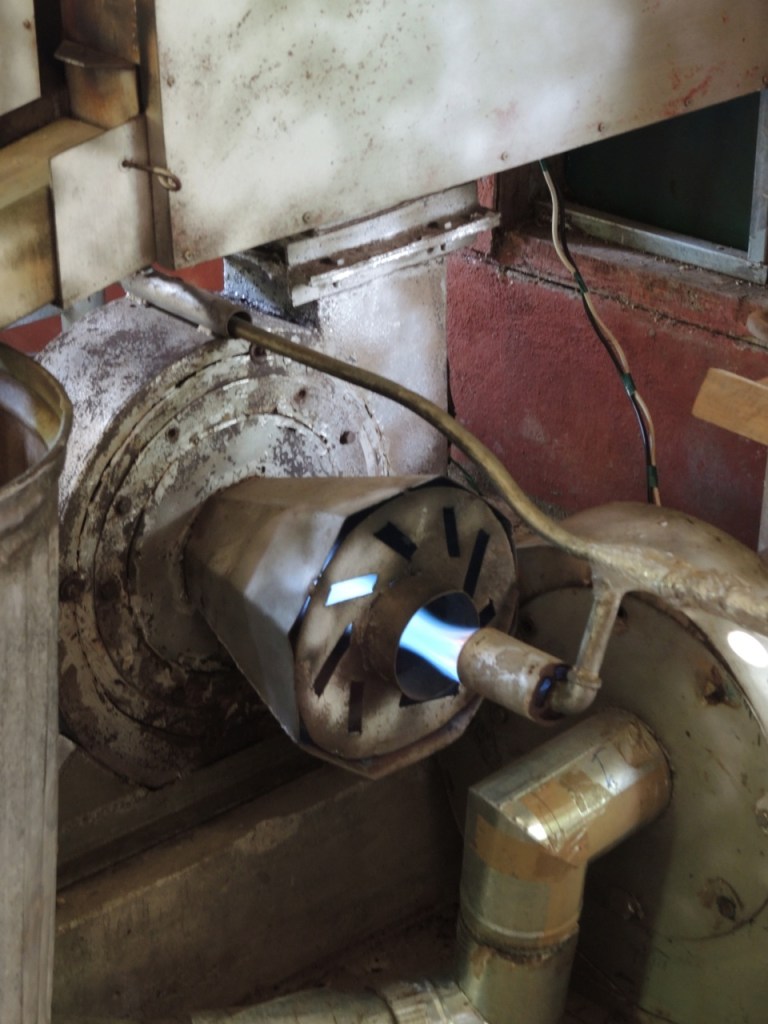 The flame from the coffee roaster (the blue jet near the middle of the photo).